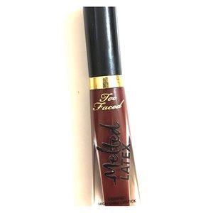 Too Faced Melted Latex Lipstick. Color is Bite Me